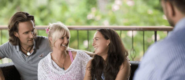 Group sitting together smiling 