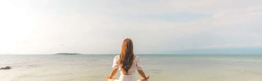 Woman sitting on the beach