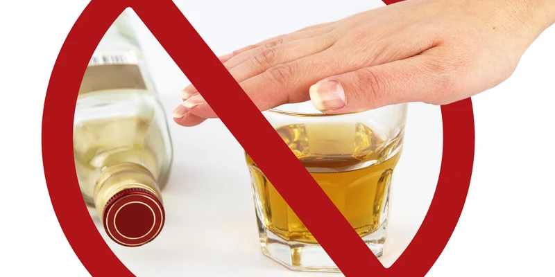 kembali alcohol detox hand holding bottle