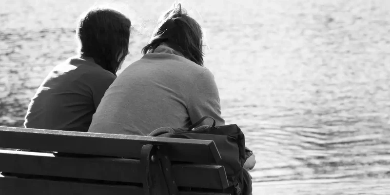 kembali drug detox two people sitting bench looking water