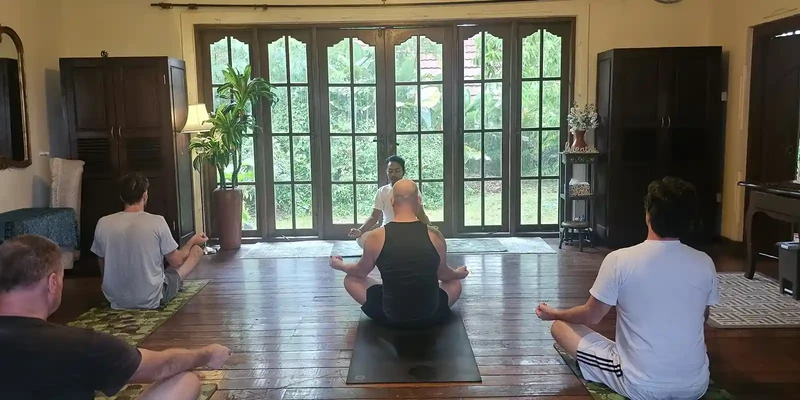 kembali group people sitting yoga mats living room
