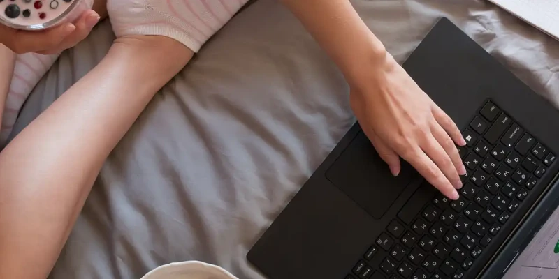kembali internet addiction woman using laptop bed