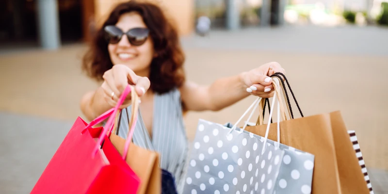 kembali shopping addiction woman holding bags