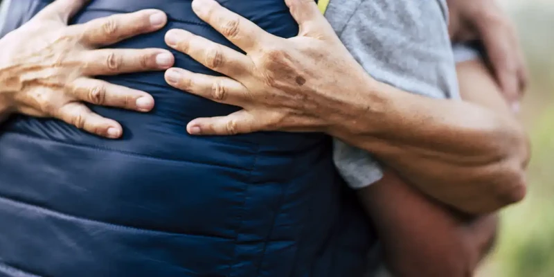 kembali therapy man holding stomach park
