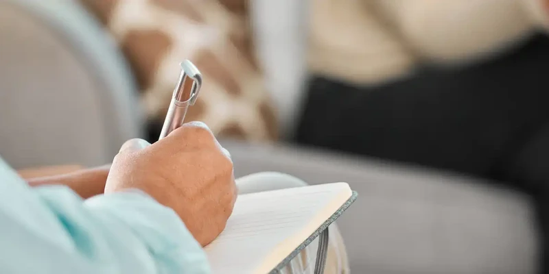 kembali therapy person writing notebook pen