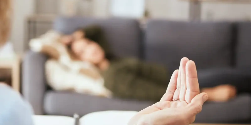 kembali therapy woman sitting couch doing yoga