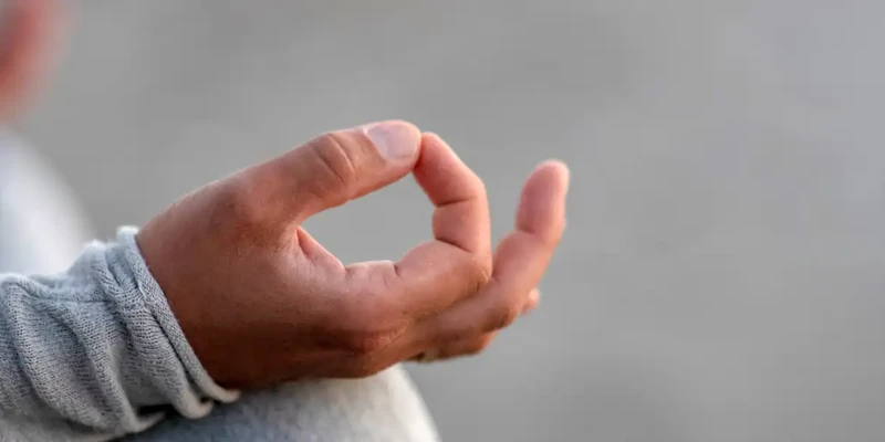 kembali yoga person holding hands